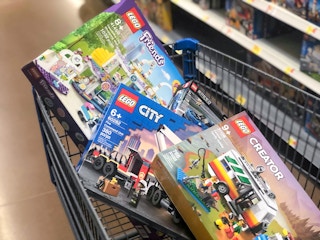 lego sets in a walmart cart in the toy aisle