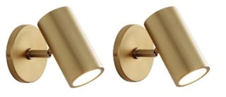 set of two modrn brass wall sconces on white background