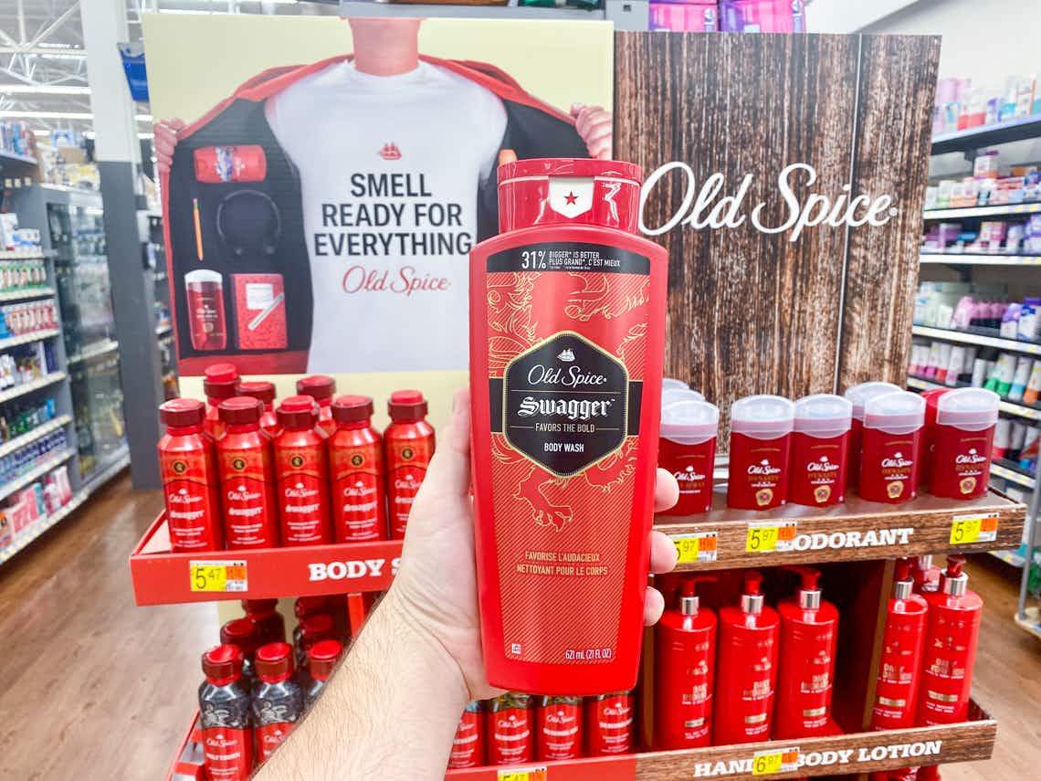 bottle of old spice red collection swagger body wash held up in walmart store in front of old spice display