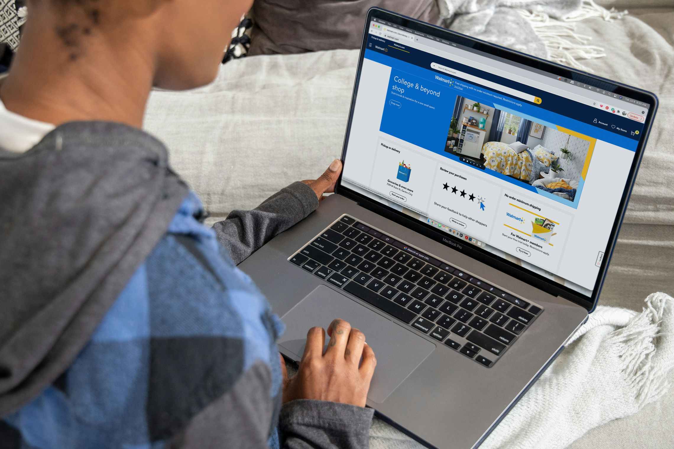 A woman on a laptop browsing Walmart.com