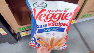 large bag of sensible portions garden veggie stars and stripes snacks held next to price tag
