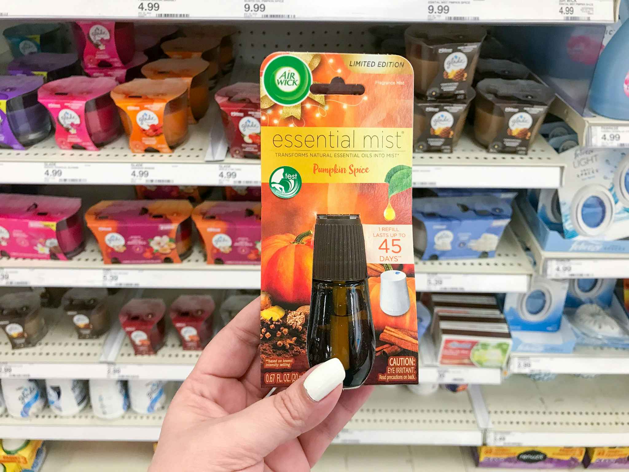 hand holding air wick essential mist refill at target
