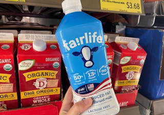 a person holding up fairlife milk