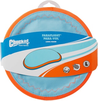 A Chuckit! Paraflight dog toy with the packaging on.