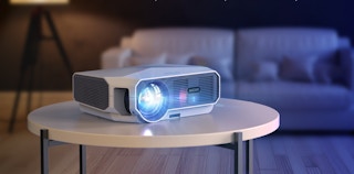 A miniature movie projector on a table.