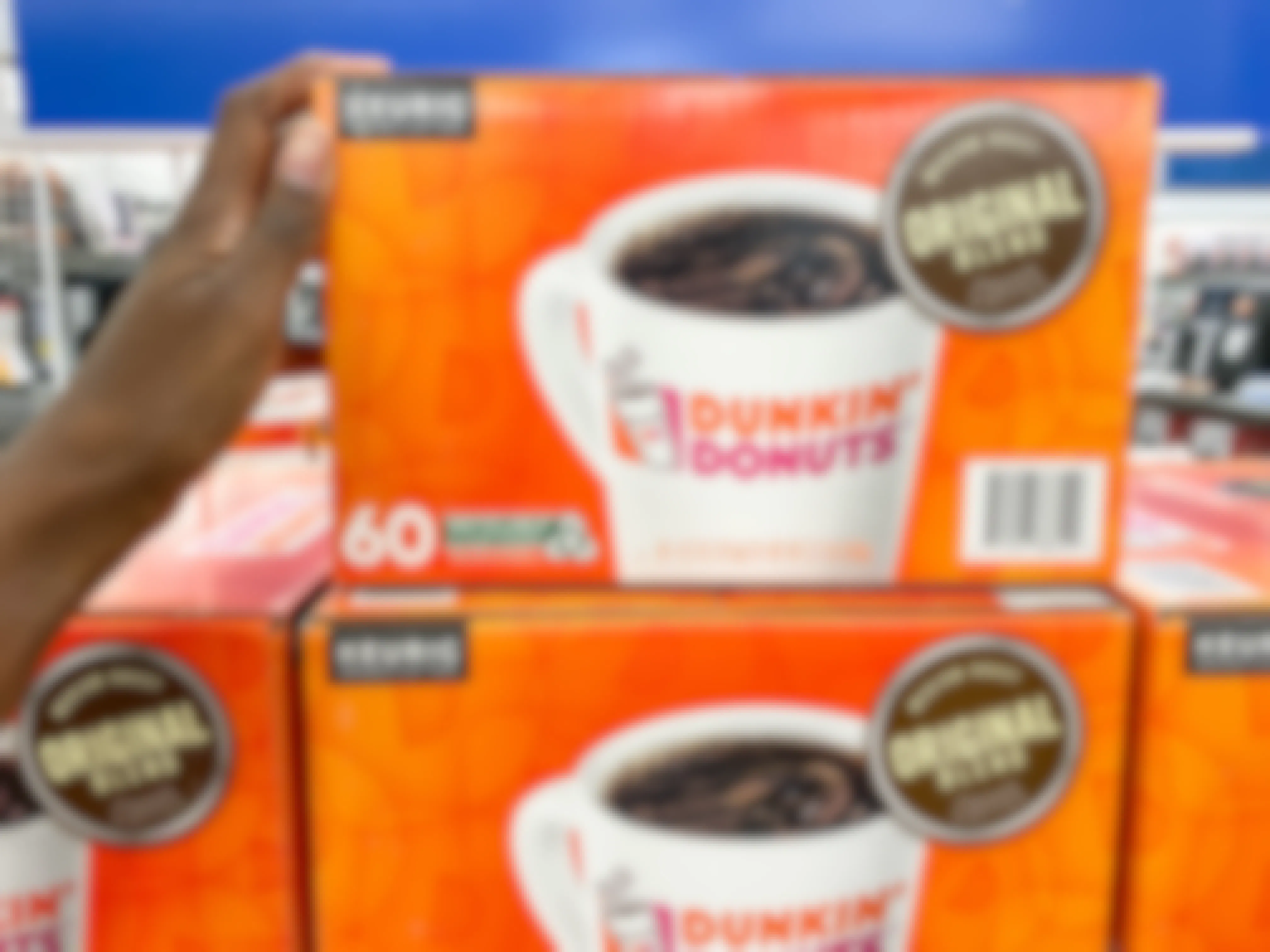 a box of Keurig dunking donuts k-cups on top of another box in bed bath and beyond