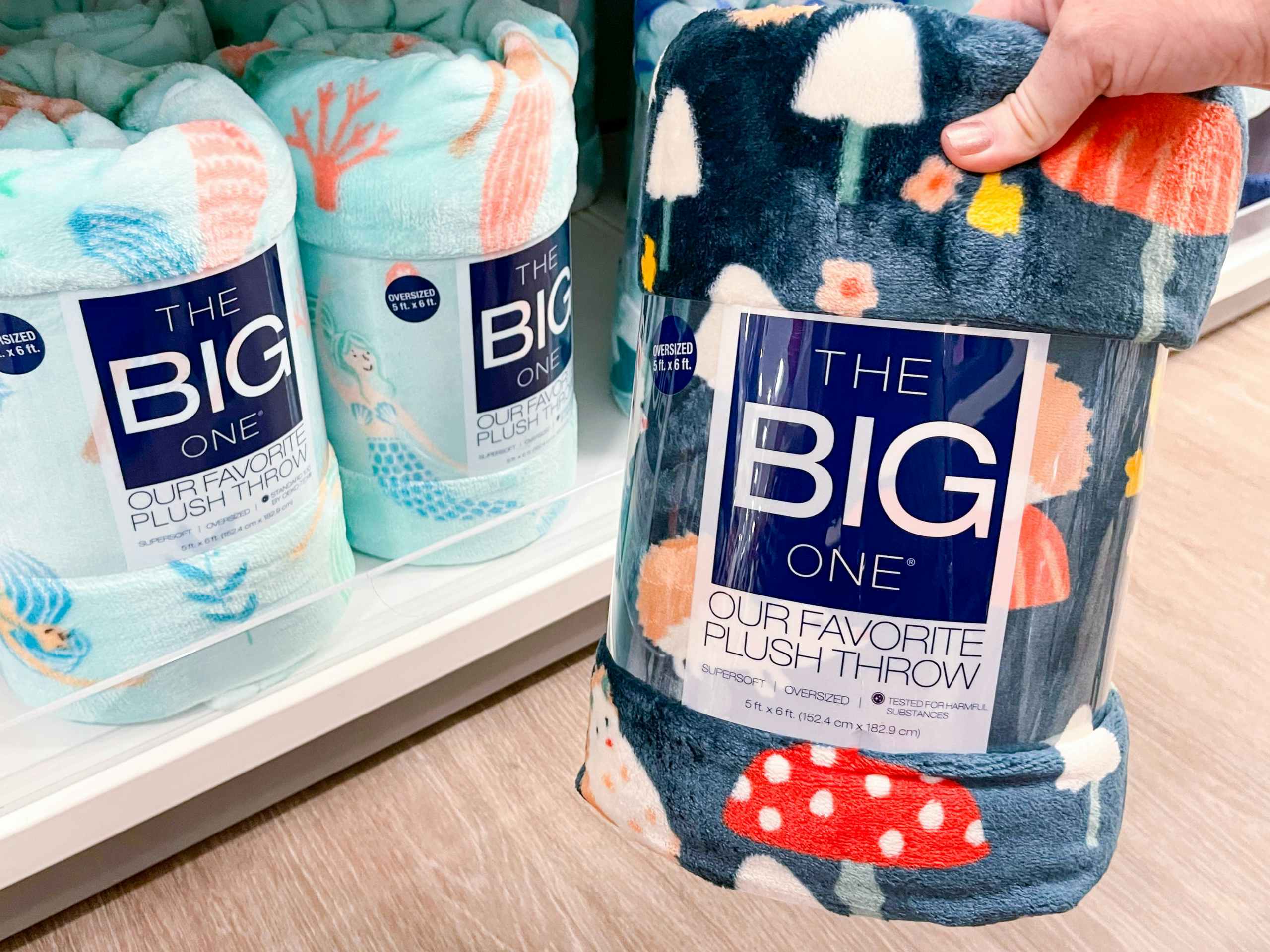 the big one plush throw on shelf