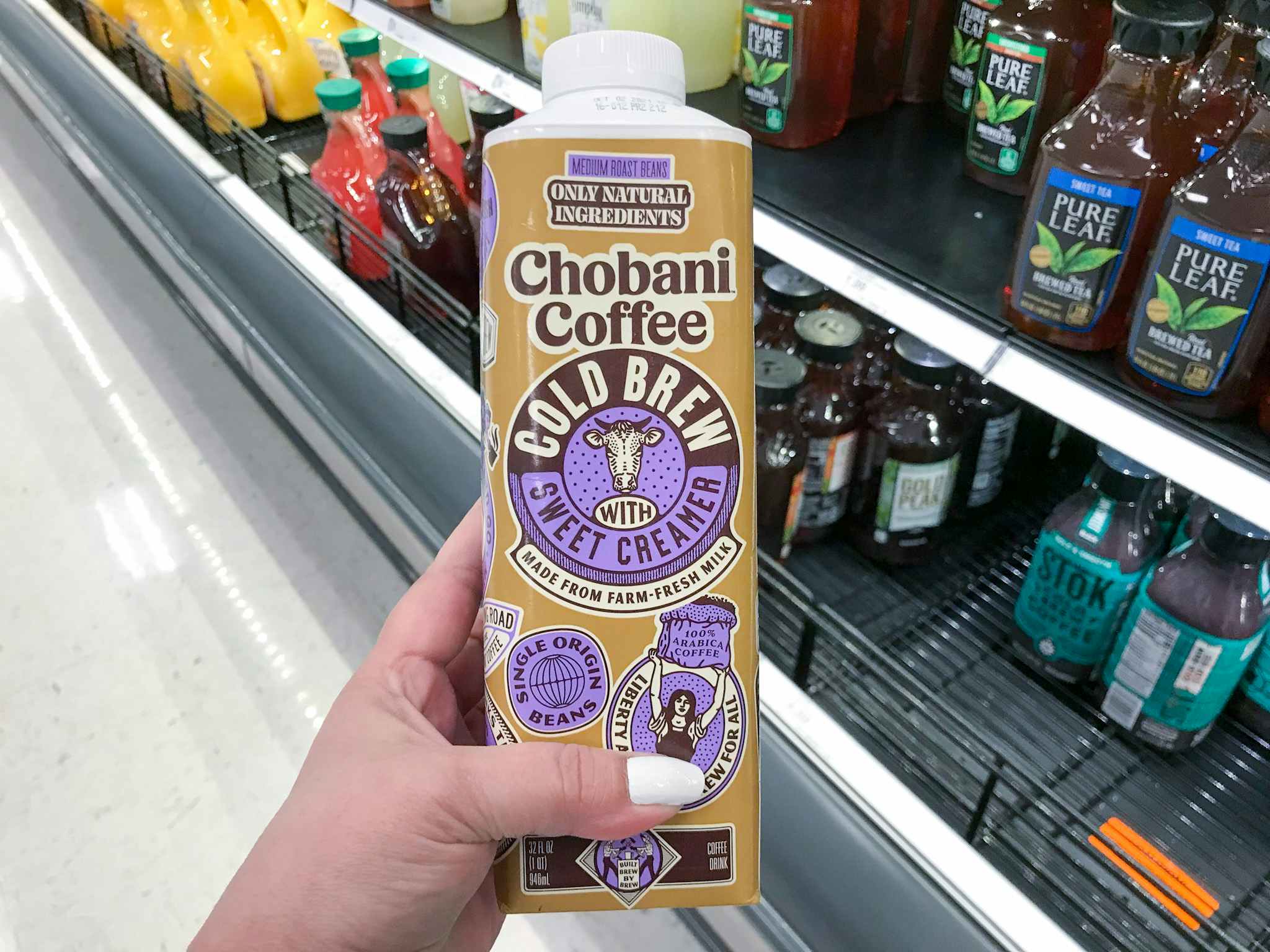 hand holding chobani cold brew at target