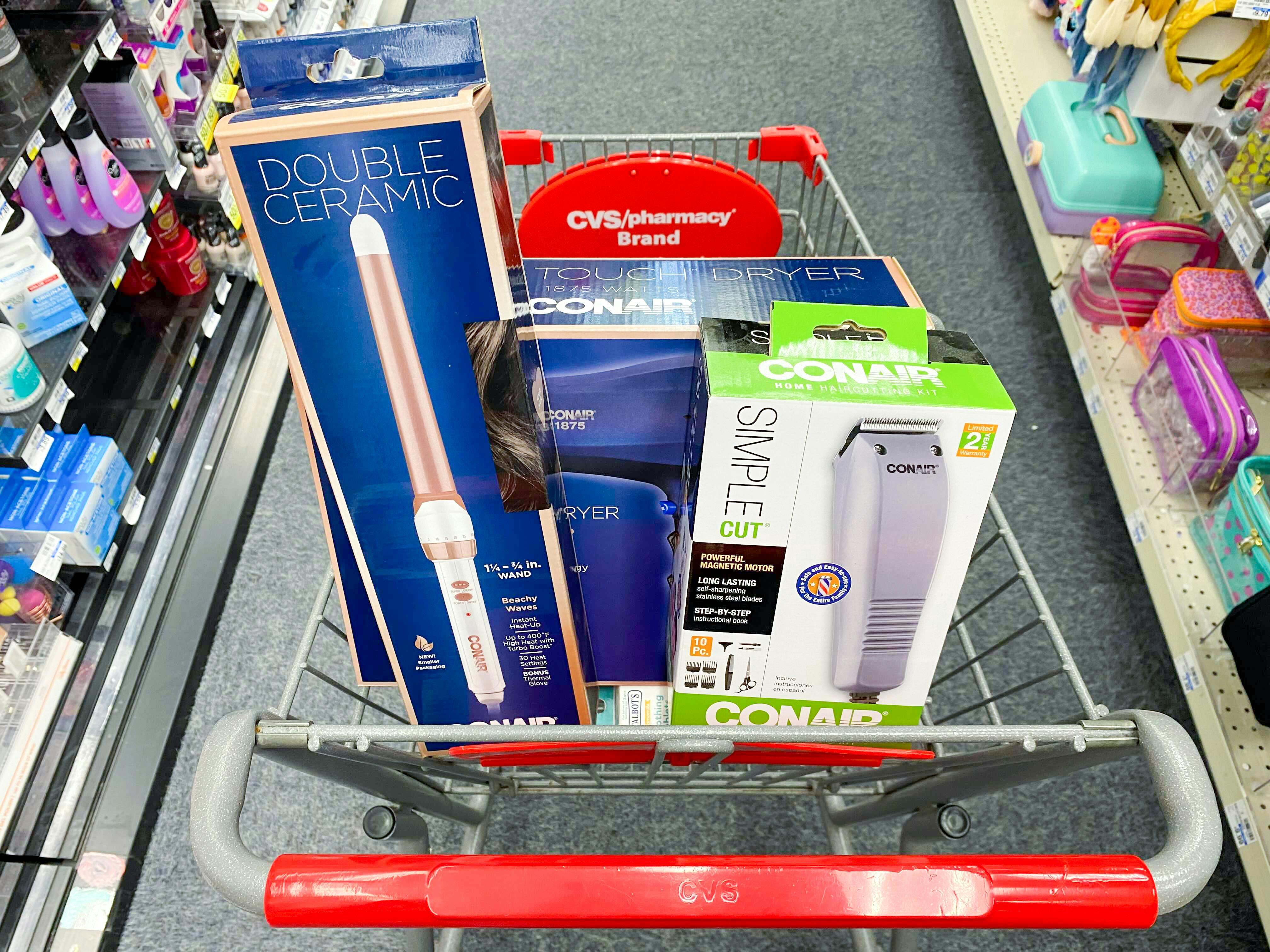 Conair hair styling and cutting tools in a CVS shopping cart.