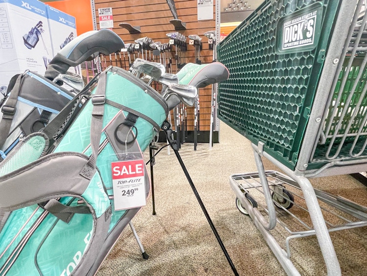 dicks sporting goods cart in front of top flite golf club sets