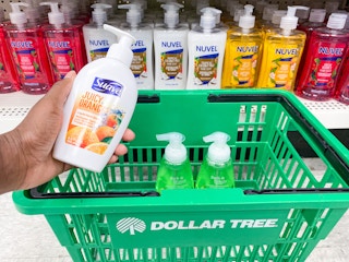 a bottle of hand soap being placed in a dollar tree basket with other hand soaps in the hand soap section in dollar tree