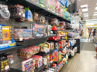 A wall of video game merchandise near the checkout counter inside GameStop.