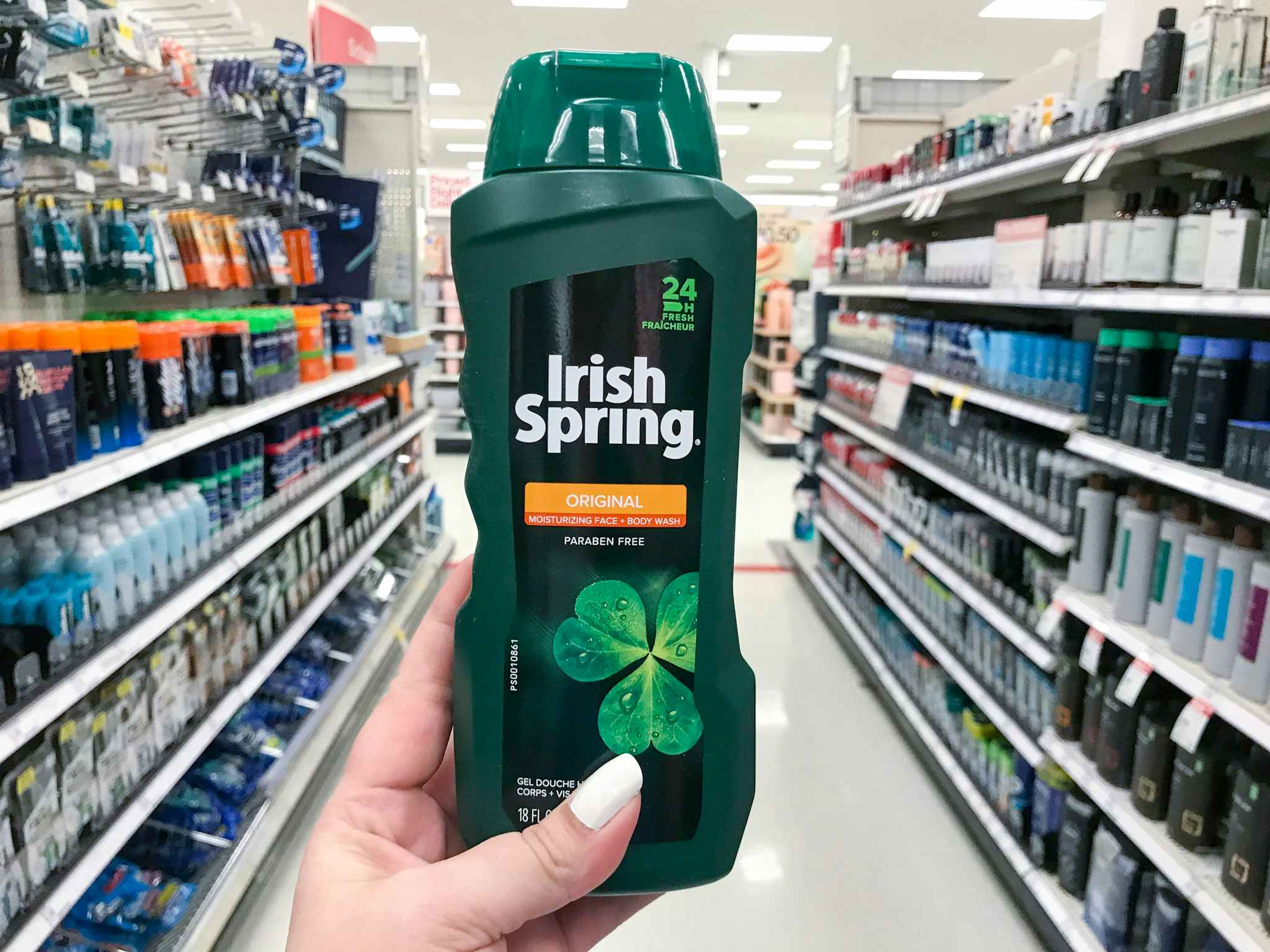 hand holding a bottle of irish spring body wash at target