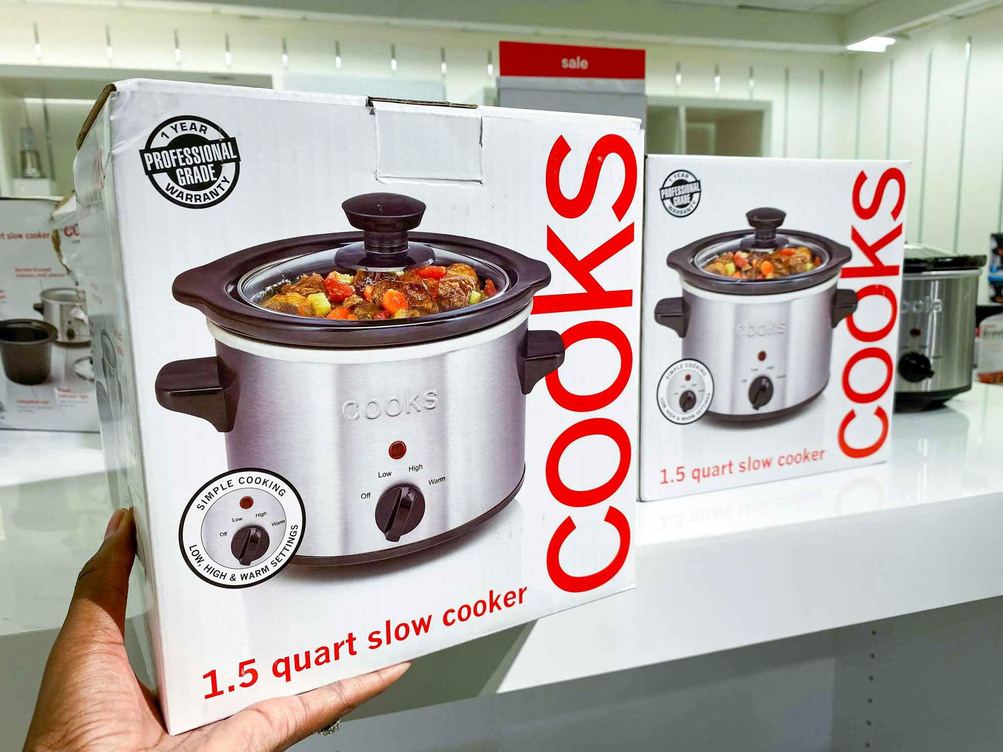 hand holding slow cooker box