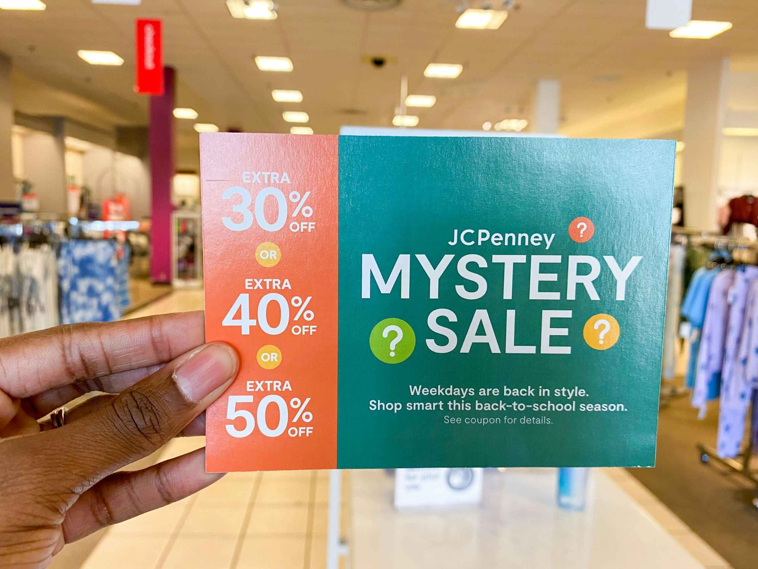 hand holding jcpenney coupon