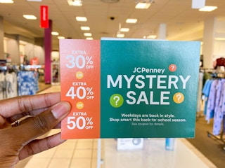 hand holding jcpenney coupon