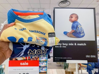 hand holding baby apparel