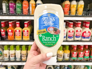 hand holding a bottle of ken's steak house ranch dressing at target