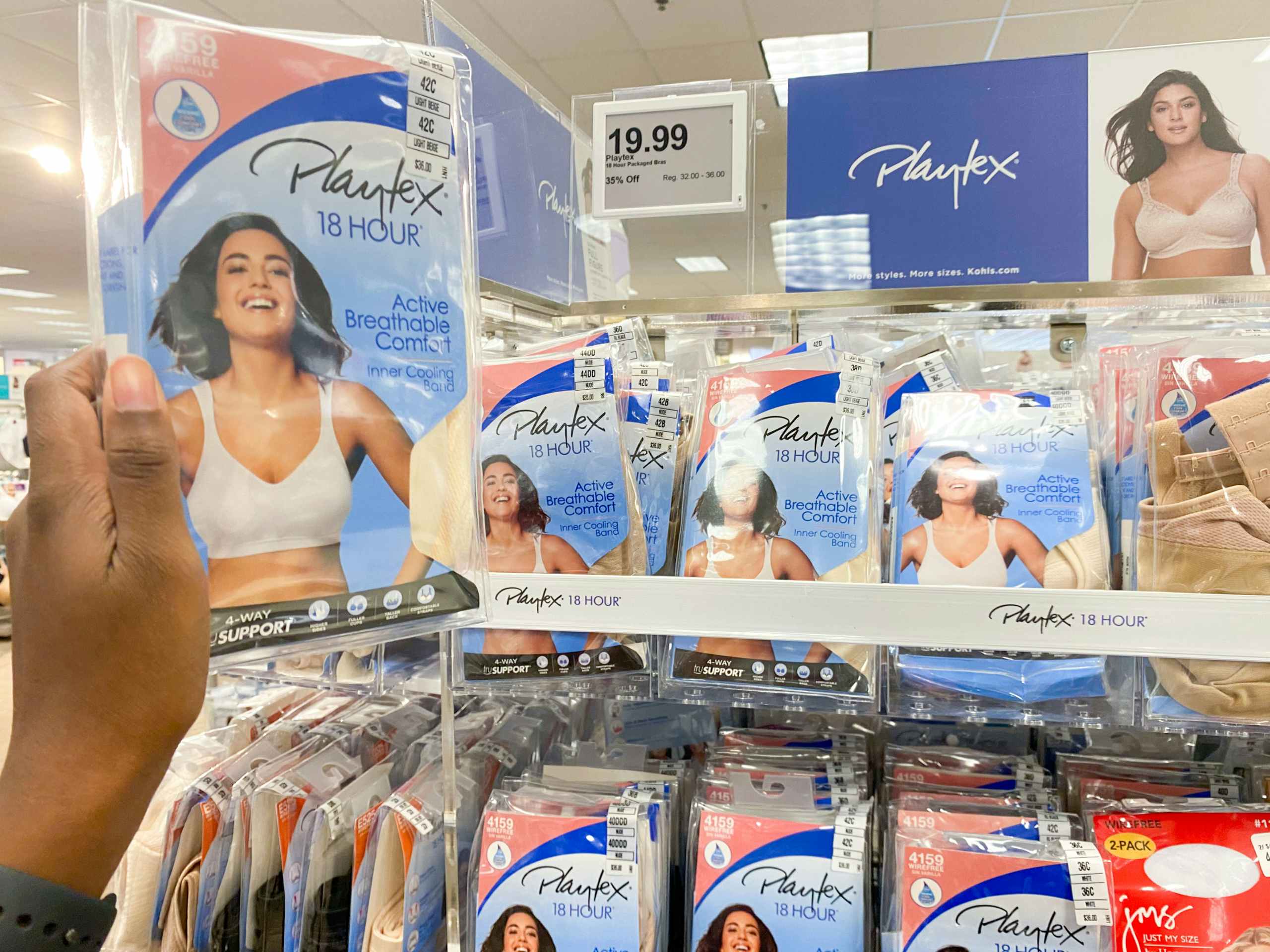 a pack of playtex bras being held up next to a display of playtex bras in kohls