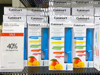 cuisinart knife sets lined up on a shelf with a sale sign reading 40 percent off next to it in macys