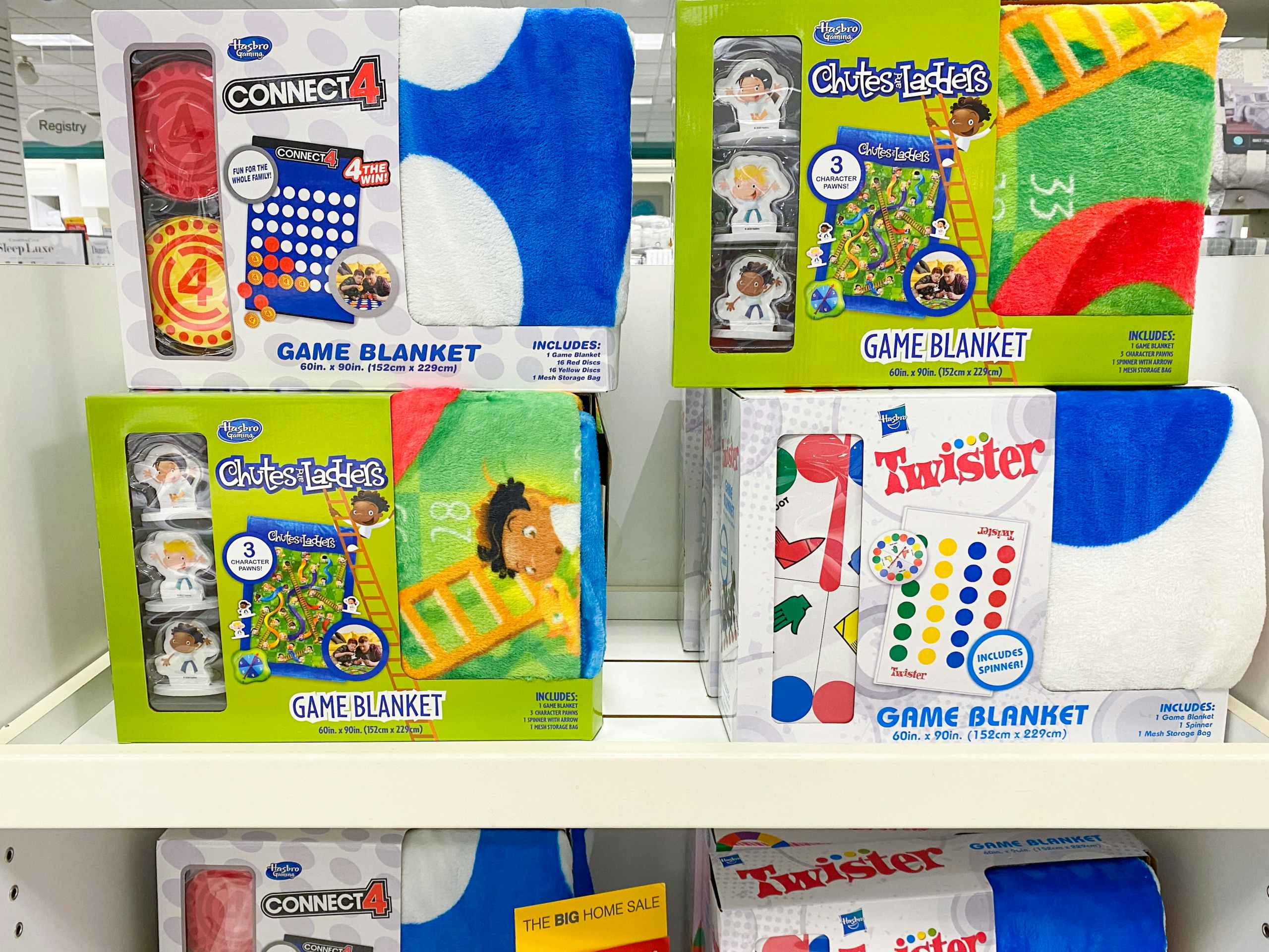 a display of hasbro game blankets on a shelf