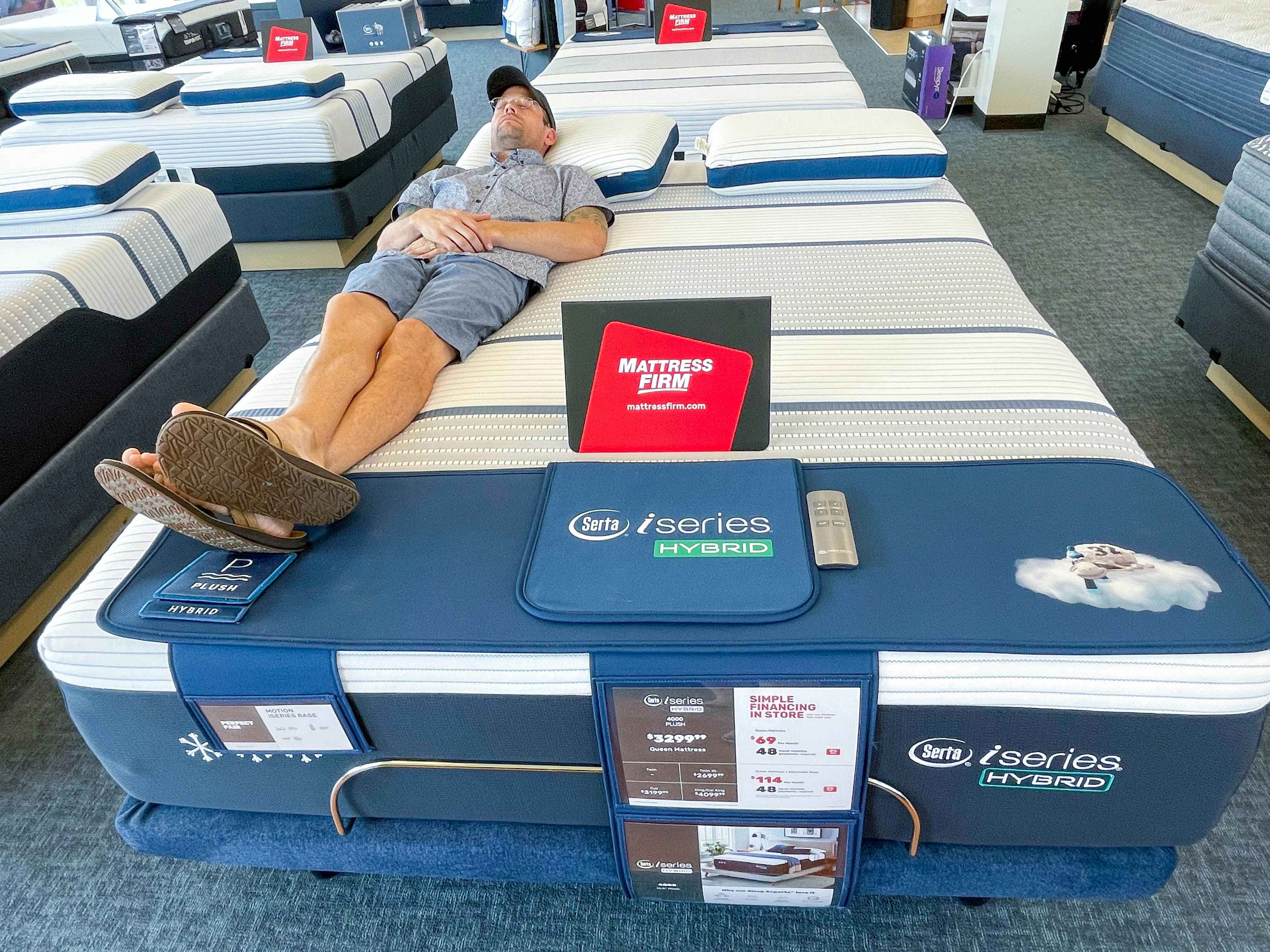 Mattress Firm display with man lying down and testing