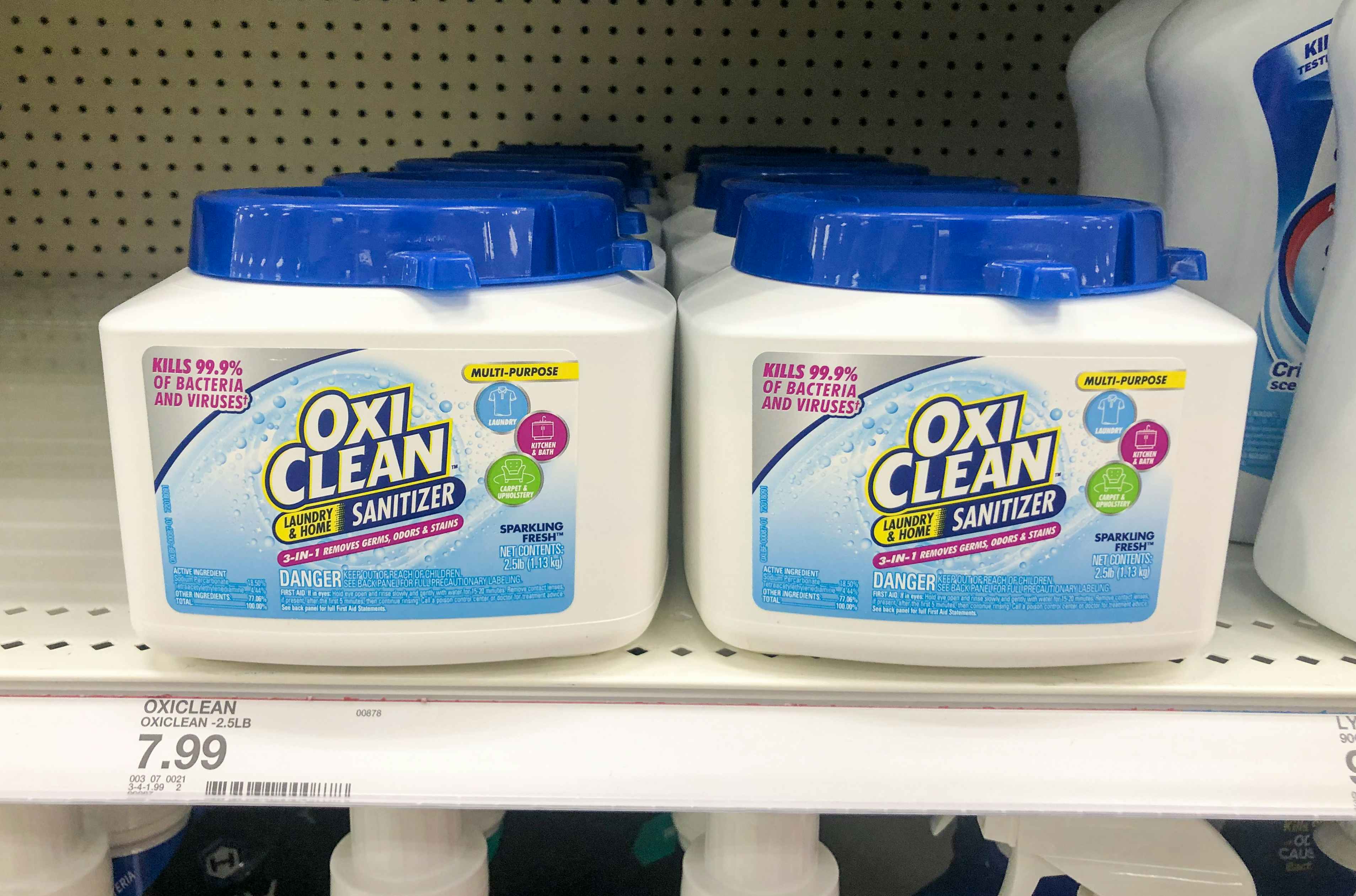 tubs of Oxi Clean sanitizer on store shelf