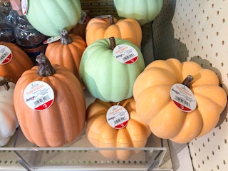 display shelf of small fake pumpkins at Target