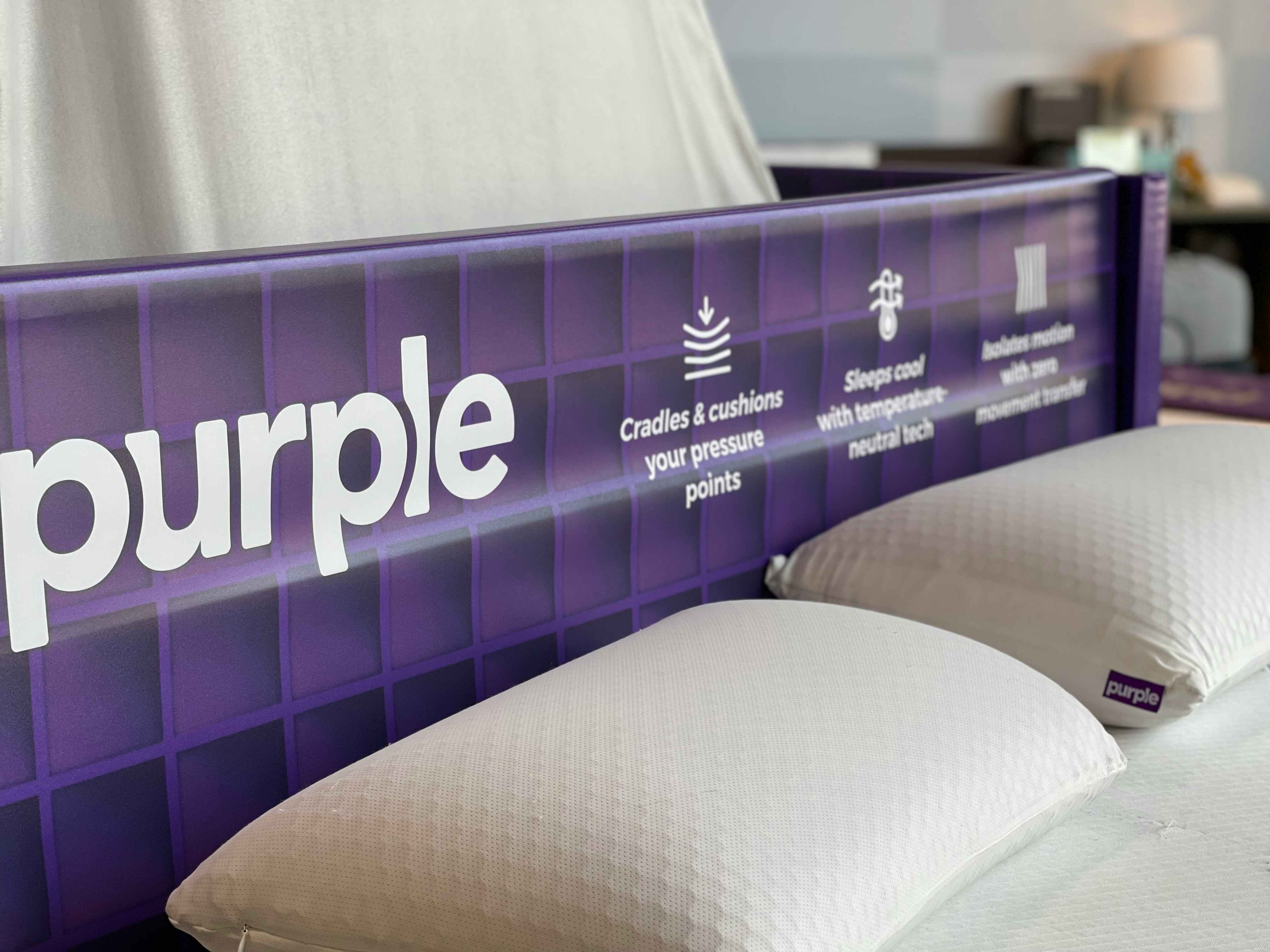 purple mattress sign and pillows
