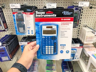 hand holding a texas instruments scientific calculator at target