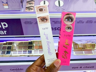 hand holding Tarte lash products