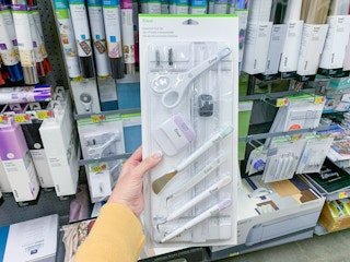 cricut essential diecutting tools held up in cricut aisle