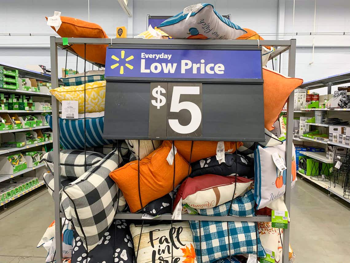 outdoor throw pillows with $5 price sign on bin
