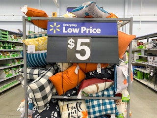 outdoor throw pillows with $5 price sign on bin
