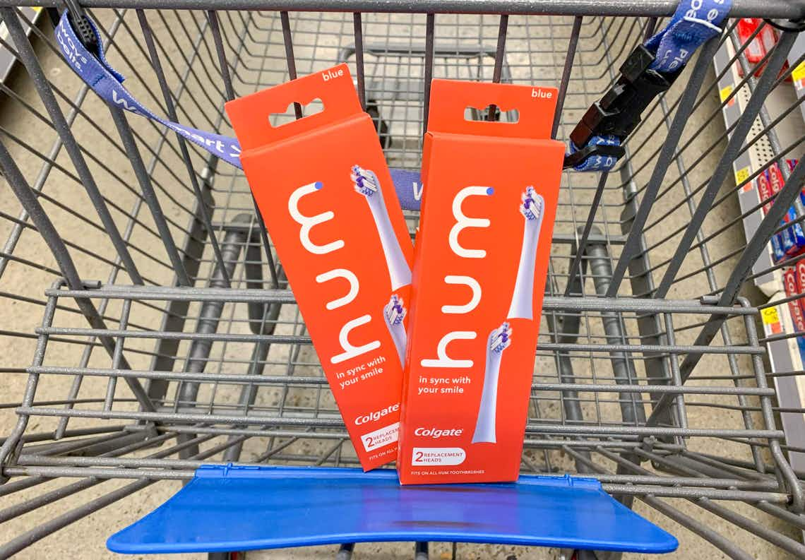 two boxes of hum by colgate toothbrush head refills in walmart cart