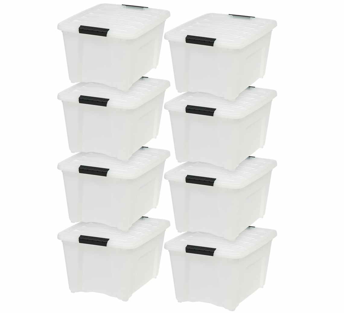 stock photo of eight iris plastic storage bins stacked up on white background