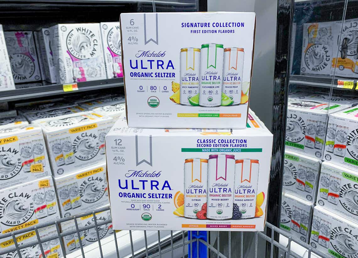 two boxes of michelob ultra seltzers stacked on walmart cart