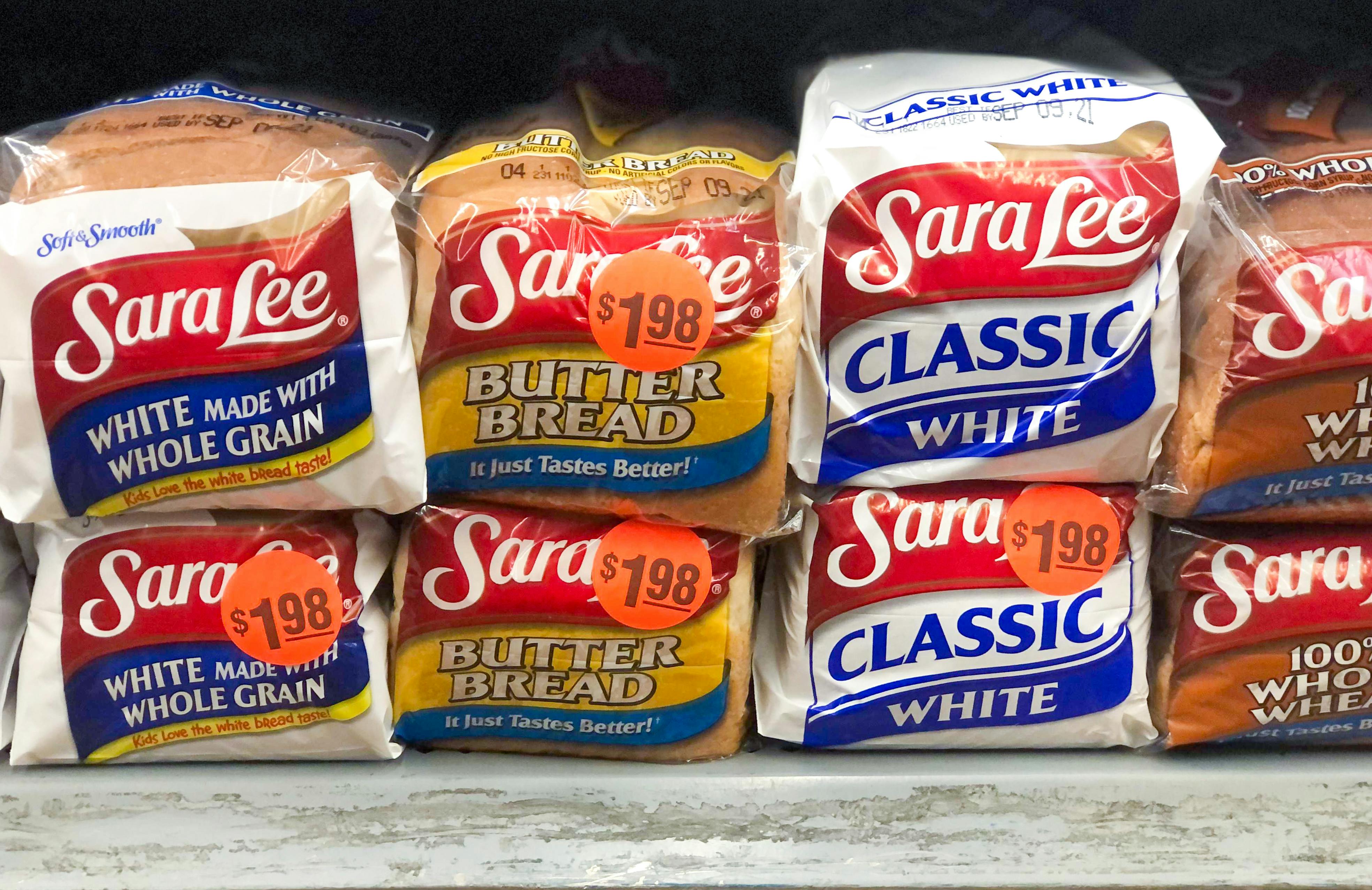 Loaves of Sara Lee bread stocked on a shelf in Walmart.