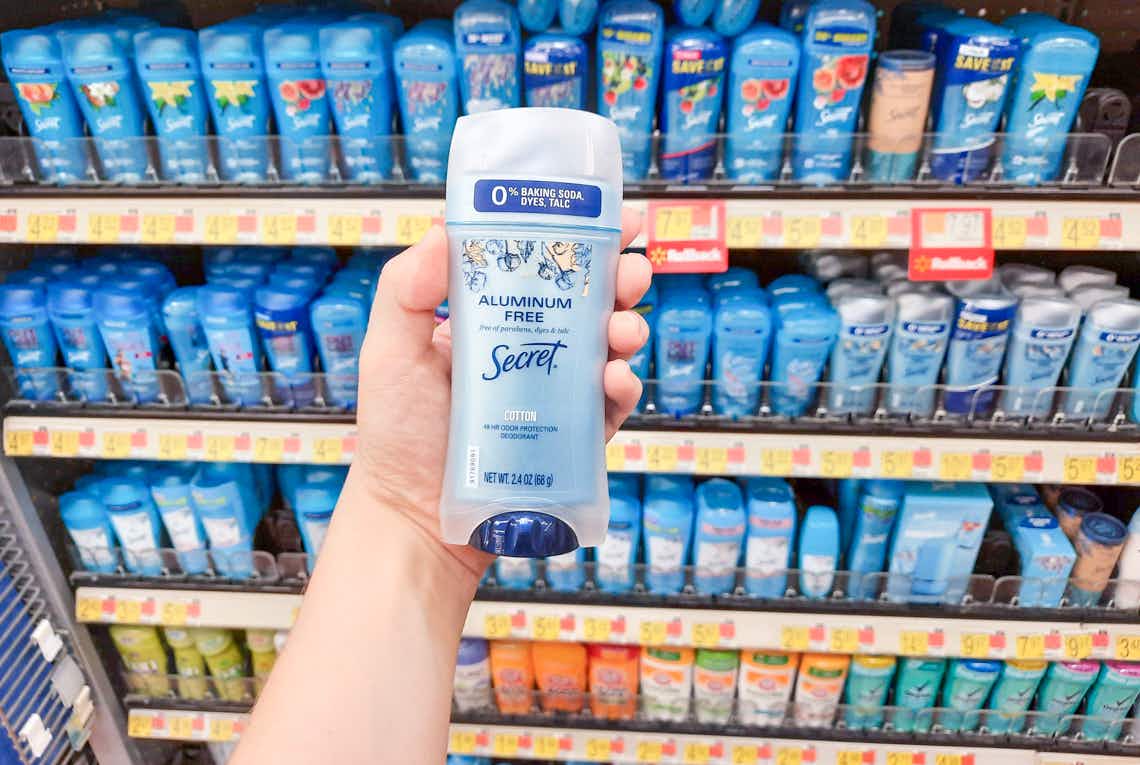 secret aluminum free deodorant held up in front of other secret products