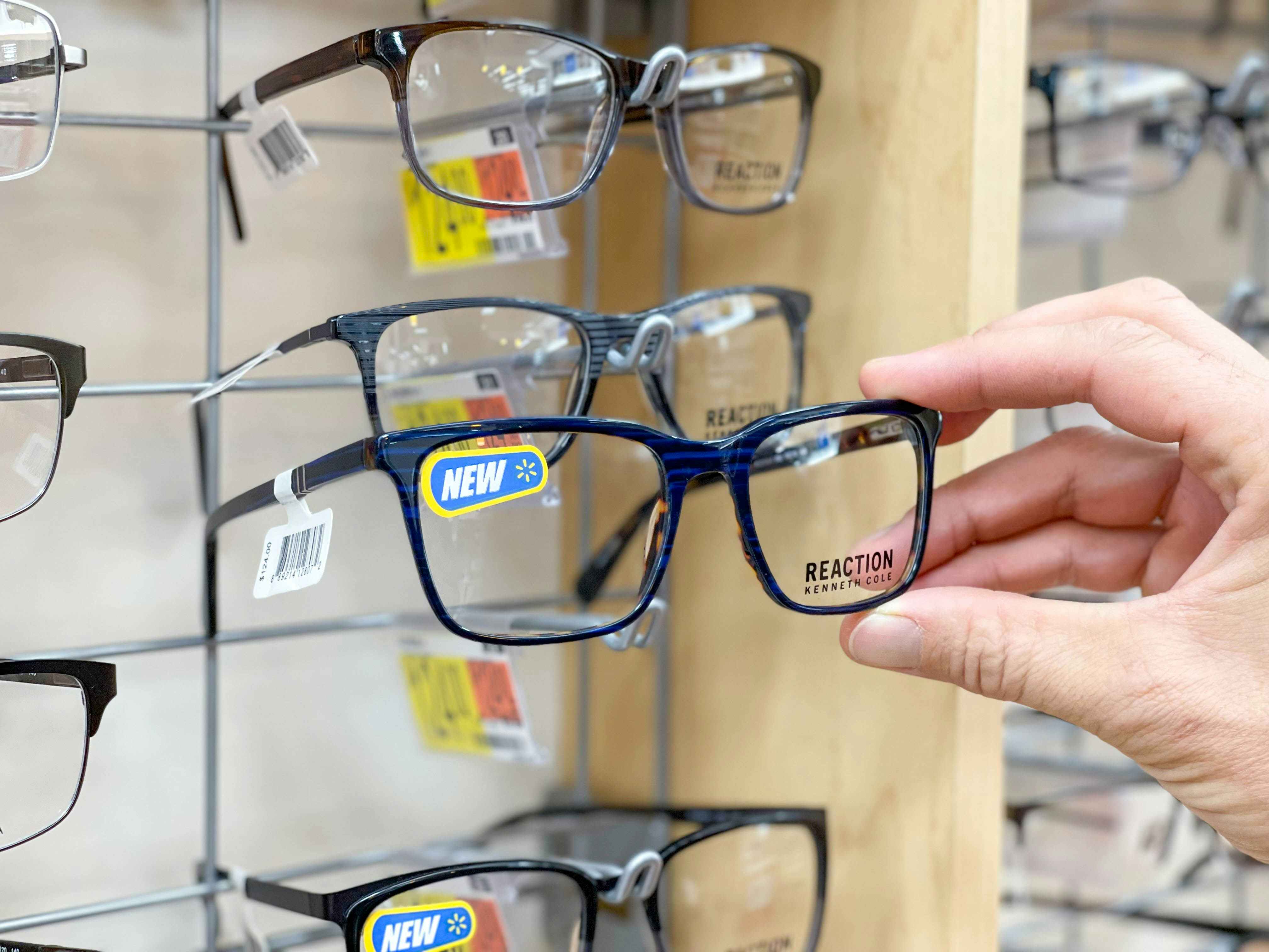 grabbing glasses off glasses display