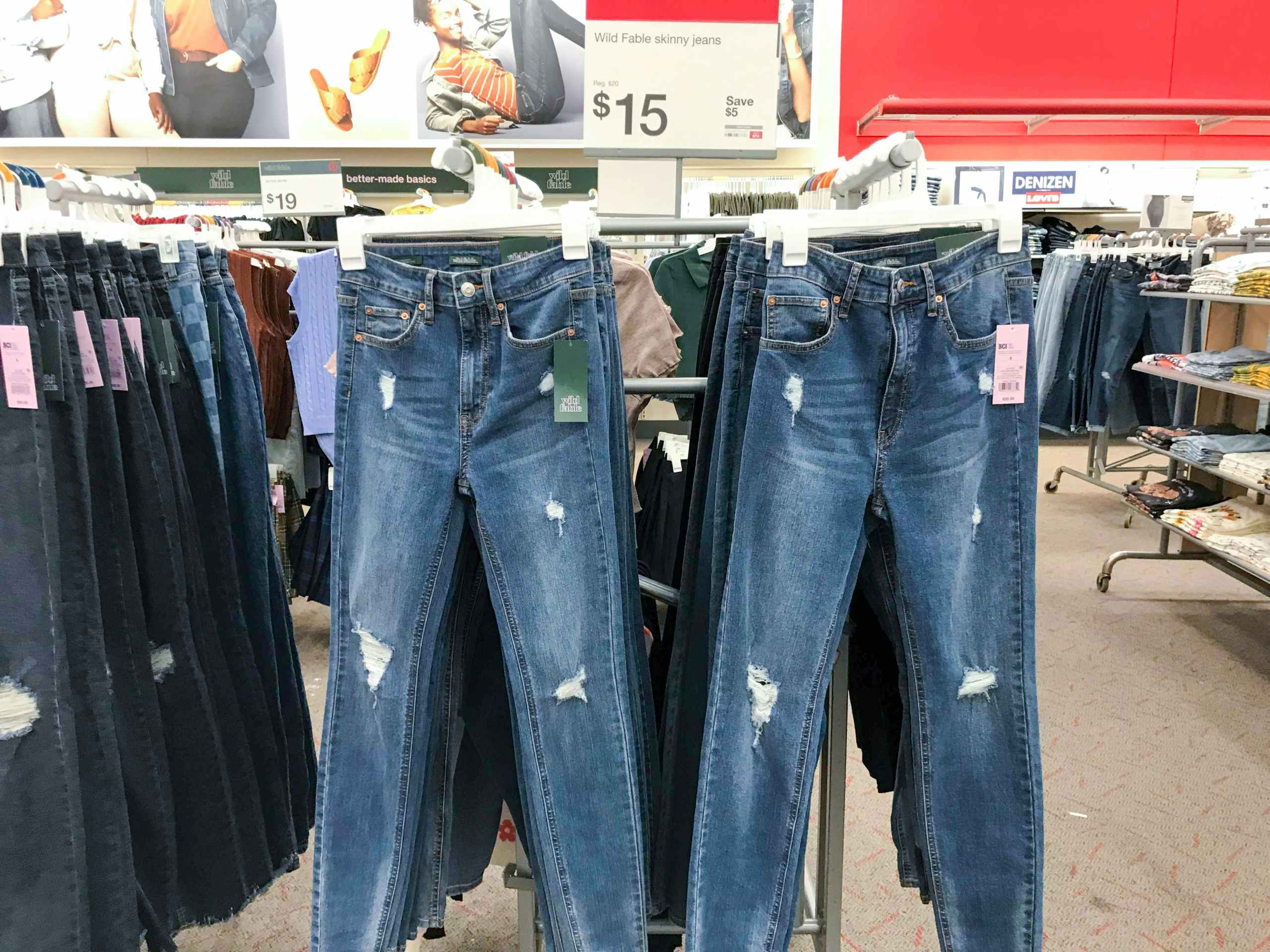 distressed jeans hanging on display at Target