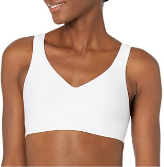 A woman wearing a white Hanes wirefree bra.