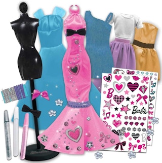 A set of Barbie fashion designer dresses and stickers.
