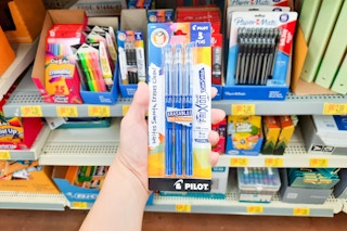 hand holding Pilot pens at Walmart