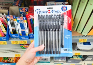 hand holding Paper Mate pens at Walmart