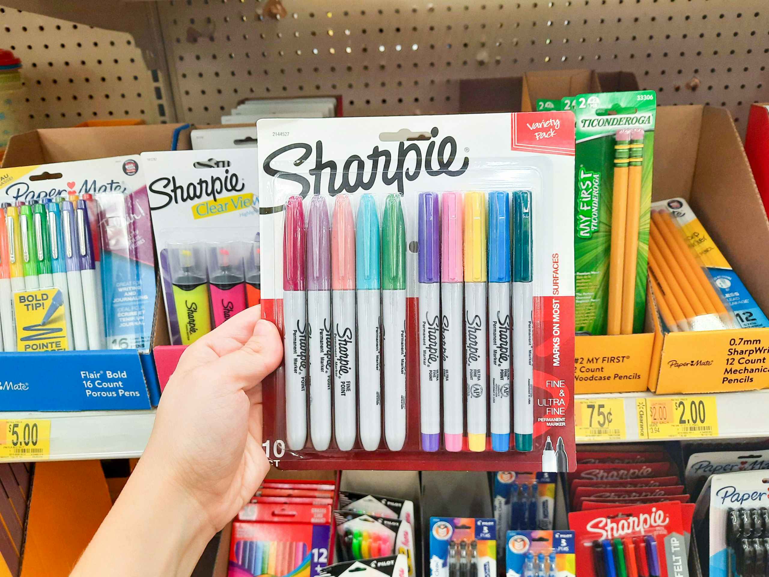 hand holding Sharpie pens at Walmart