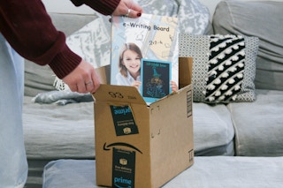 E writing board being removed from box