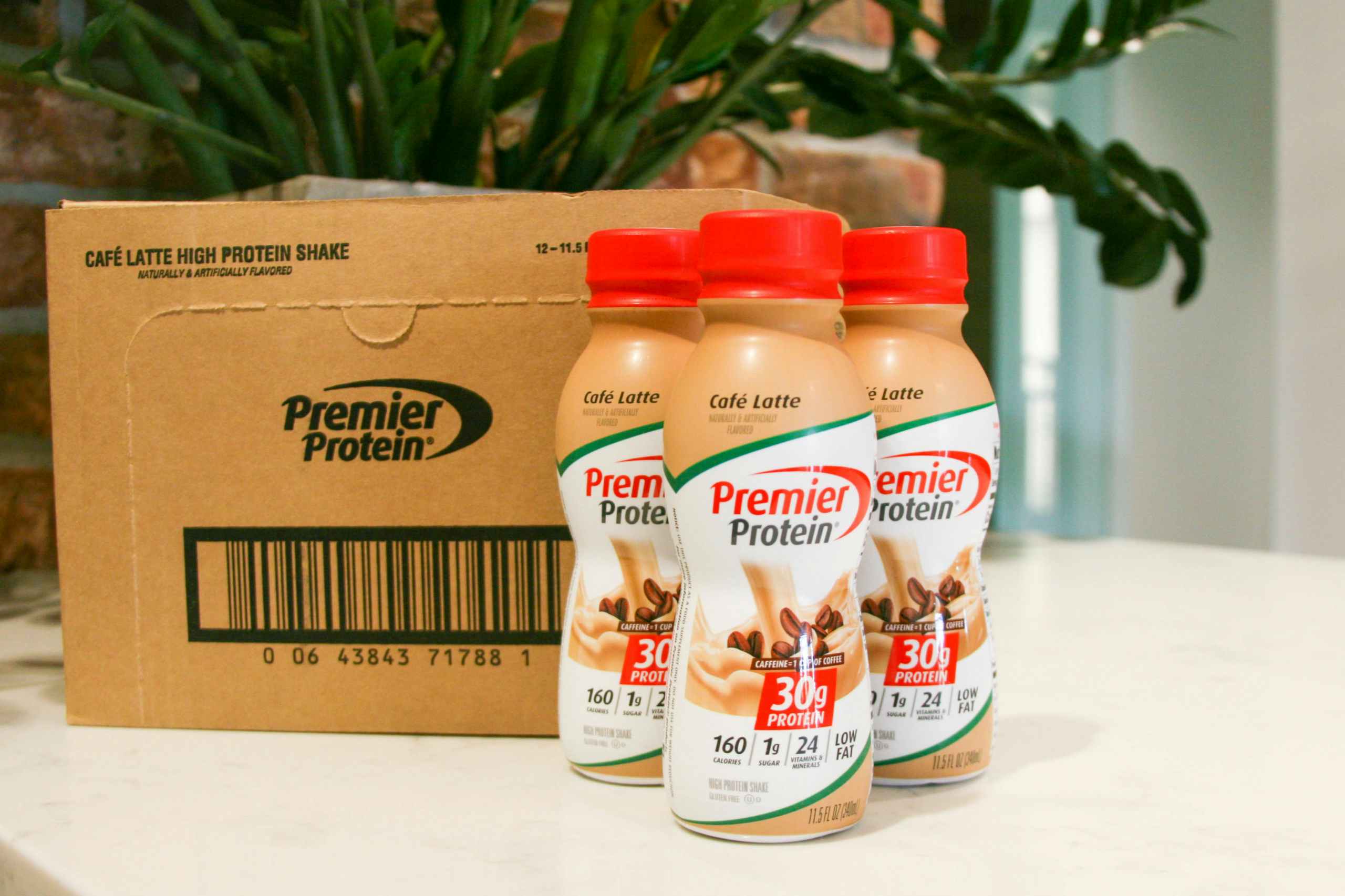 premier protein shakes next to box