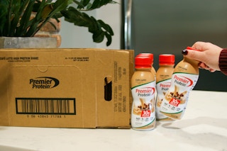 premier protein shakes next to box