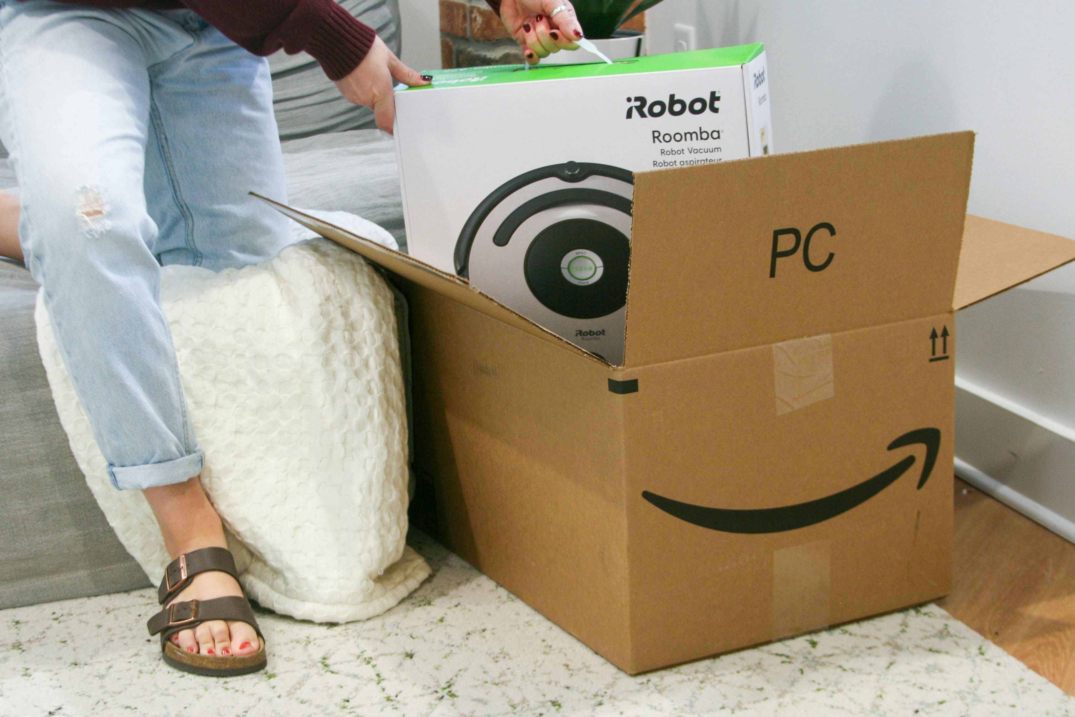 robot roomba coming out of amazon box